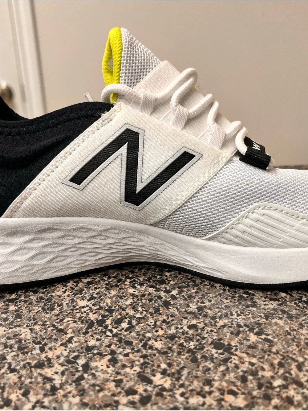 New Balance White Black Athletic Running Shoes with Yellow Accent